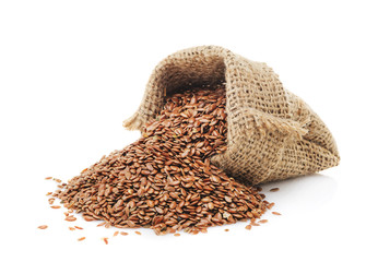 Wall Mural - Flax seeds in a bag isolated 