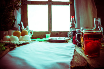 Colored eggs wooden table rural hut