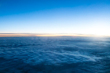 Wall Mural - beautiful dark sunset above clouds