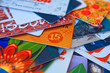 bright plastic discount cards closeup. market background. select