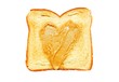 Peanut butter spread in a heart shape on a piece of toast