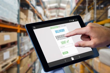 Poster - Composite image of man using tablet pc 
