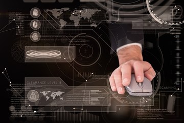 Poster - Composite image of businessman in suit using mouse