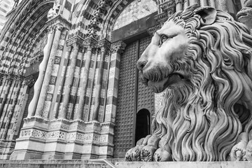 Wall Mural - Lion's figure in front of Cathedral Saint Lawrence in Genoa, Italy.