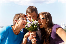 Funny Groom With Mother And Sister Eat Bouquet Of Flowers