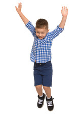 Bouncing the little boy in the blue plaid shirt and blue shorts - Isolated on white background