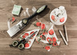 Decoupage accessories - brush, sponge, paint, tissues, pencils, scissors and papers on wooden table - flat lay, high angle.