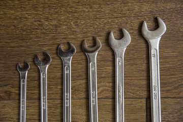 set of mechanical hand tools on wooden background