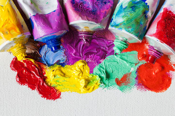 Poster - Tubes of oil paint and artist paintbrushes closeup on artistic c