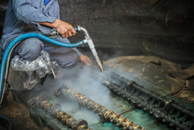 Worker Is Cleaning The Machine Equipment By Using The Air Pressure Sand / Dryice Blasting 