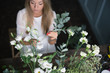 © cherry_d - Florist at work: pretty young blond woman making fashion modern bouquet of different flowers