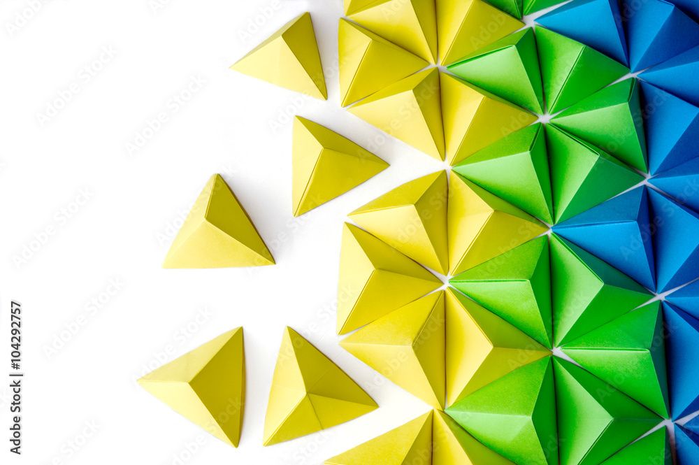 Origami tetrahedrons background. Futuristic polygonal composition with copy space on the left side. - obrazy, fototapety, plakaty 