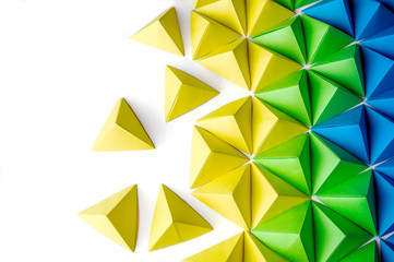 origami tetrahedrons background. futuristic polygonal composition with copy space on the left side.