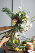 © cherry_d - Florist at work: pretty young blond woman making fashion modern bouquet of different flowers