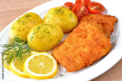 Nowoczesny obraz na płótnie ryba smażona z ziemniakami i pomidorem