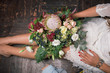 © cherry_d - Florist at work: pretty young blond woman holds fashion modern bouquet of different flowers
