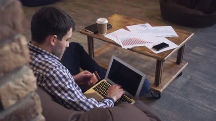 Poster - Man with a laptop and a credit card to pay the bill.