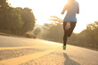 © lzf - young fitness woman runner athlete running at road
