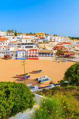 Wall Mural - A view of Carvoeiro fishing village with colourful houses on beach, Algarve, Portugal