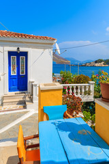 Wall Mural - Typical Greek street in Kokkari town with sea view, Samos island, Greece