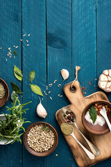 Poster - culinary background with spices on wooden table