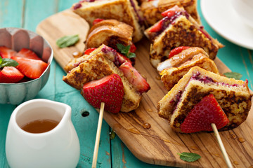 French toast pieces on a skewer with strawberry