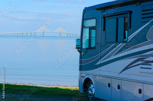 Fotografie, Obraz RV recreational vehicle is parked at the beach overlooking Tampa Bay in Fllorida