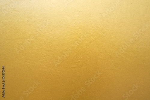 Fotografía Muro de hormigón de oro en la textura de fondo.