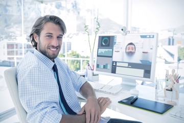 Poster - Composite image of nervous businessman peeking over desk