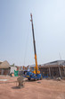 © geargodz - Crane lifting concrete mixer container