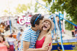 © Westend61 - Happy couple at fun fair