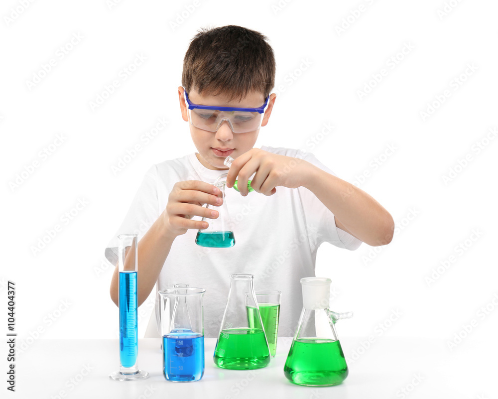 Clever little boy doing a chemical experiments, isolated on white