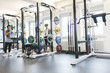 © Westend61 - Three women doing barbell bench presses in a power rack