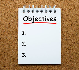Poster - objectives on white paper notebook