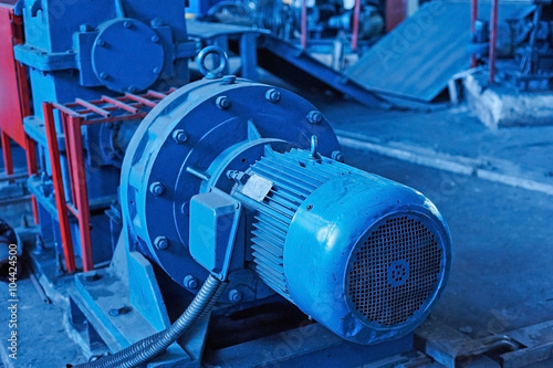 Fotografia, Obraz Electric actuator for industrial mill in workshop