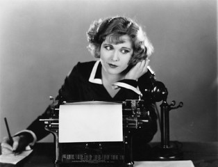 Canvas Print - Woman at typewriter on telephone 