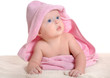 © jordano - Adorable baby girl under a pink towel