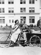 Couple Riding Tandem Bike 