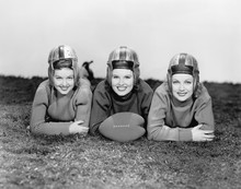 Portrait Of Three Women In Football Helmets 