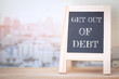 © sitthiphong - Concept GET OUT OF DEBT message on wood boards