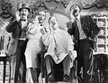 Four Men At A Barber Shop Singing 