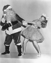 Woman Trying To Dance With Santa Claus 