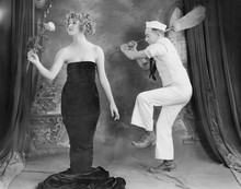 Sailor Hitting Elegant Woman With Broom 