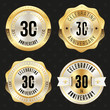 Collection of gold  30th anniversary badges on black background