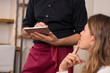 © Rido - Waiter taking order at restaurant