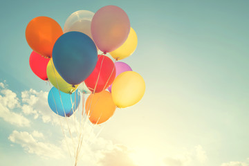 multicolor balloons with a retro instagram filter effect, concept of happy birthday in summer and we