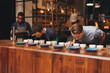 © mavoimages - Barista training in a modern roastery with managers taking notes