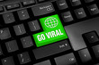 Black Computer keyboard with green go viral button