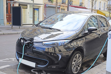 Wall Mural - Paris, France, February 9, 2016: electric car charges in Paris, France