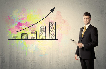 Happy businessman with colorful chart